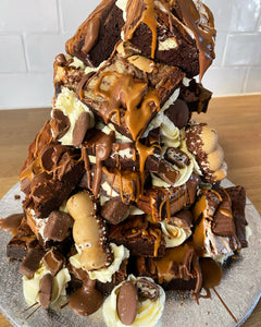 Brownie tower cake with buttercream, lotus spread and toppings